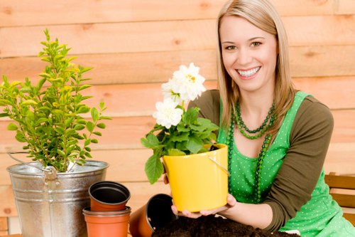 Gardener wearing PPE operating equipment
